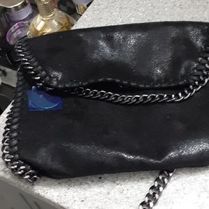 Womans black chain accent crossbody bag